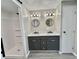 Modern bathroom features double vanity sinks and a new shower at 519 Hawthorne Blvd, Leesburg, FL 34748