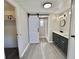 Bathroom with new barn door and sink at 519 Hawthorne Blvd, Leesburg, FL 34748
