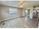 This bright bedroom features a ceiling fan, closet with mirrored doors, sleek floors and natural light at 519 Hawthorne Blvd, Leesburg, FL 34748