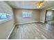 This cozy bedroom features sleek floors, ample natural light, and a spacious closet for optimal comfort at 519 Hawthorne Blvd, Leesburg, FL 34748