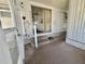 View of enclosed porch showing access to the home's interior at 519 Hawthorne Blvd, Leesburg, FL 34748