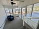Screened-in porch with a comfortable seating area and outdoor views at 519 Hawthorne Blvd, Leesburg, FL 34748