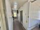Hallway with storage and access to additional rooms at 519 Hawthorne Blvd, Leesburg, FL 34748