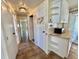 Hallway with white cabinets and countertop at 519 Hawthorne Blvd, Leesburg, FL 34748