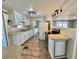 Cozy kitchen featuring stainless appliances, tile floors, and ample cabinet space at 519 Hawthorne Blvd, Leesburg, FL 34748