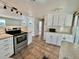 Spacious kitchen with stainless steel oven, tile floors, and good cabinet space at 519 Hawthorne Blvd, Leesburg, FL 34748