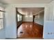View of the living room showcasing hardwood flooring and an open layout at 519 Hawthorne Blvd, Leesburg, FL 34748
