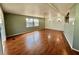 Spacious living room with laminate floors, natural light, and modern fixtures at 519 Hawthorne Blvd, Leesburg, FL 34748