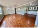 Inviting living area with hardwood floors, connecting to an open kitchen space at 519 Hawthorne Blvd, Leesburg, FL 34748