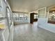 Bright sunroom with tile floors and expansive windows, perfect for relaxation and enjoying the view at 519 Hawthorne Blvd, Leesburg, FL 34748