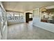 Sun-drenched room with tile floors and ample windows overlooking the community at 519 Hawthorne Blvd, Leesburg, FL 34748