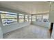Bright sun room with tile flooring and large windows providing lots of natural light at 519 Hawthorne Blvd, Leesburg, FL 34748