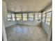 Sun-filled room with tile floors and lots of windows at 519 Hawthorne Blvd, Leesburg, FL 34748