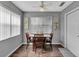 Cozy dining area featuring modern light fixtures, window with blinds, and beautiful wall art at 529 Valencia Pl, Lady Lake, FL 32159