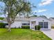 Charming single-story home with well-maintained lawn and driveway, and a welcoming front entrance at 529 Valencia Pl, Lady Lake, FL 32159