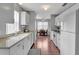 Bright kitchen with modern appliances and ample counter space, flowing into a dining area at 529 Valencia Pl, Lady Lake, FL 32159