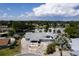 Stunning aerial view of home on a waterfront lot with boat docks and private drive at 5339 Kings Ct, Fruitland Park, FL 34731
