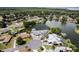Overhead view of lakeside houses showcasing private boat docks, serene water views, and mature trees at 5339 Kings Ct, Fruitland Park, FL 34731