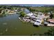 Lakefront property features private docks and lush landscaping, creating a waterfront oasis at 5339 Kings Ct, Fruitland Park, FL 34731