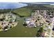 Gorgeous lakefront homes with private boat docks, surrounded by nature, offer a serene lifestyle at 5339 Kings Ct, Fruitland Park, FL 34731