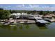 Lakefront home with a private boat dock, blending seamlessly with the serene waterfront landscape at 5339 Kings Ct, Fruitland Park, FL 34731