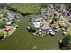 Beautiful lakefront houses with private boat docks create a tranquil, waterside community at 5339 Kings Ct, Fruitland Park, FL 34731