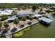 Beautiful waterfront home featuring an expansive screened lanai, private boat dock, and meticulously maintained landscaping at 5339 Kings Ct, Fruitland Park, FL 34731