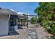 Backyard access to the waterfront featuring a pergola, garden area, and access to outdoor entertaining at 5339 Kings Ct, Fruitland Park, FL 34731