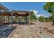 Waterfront backyard featuring a pergola, garden area, and access to outdoor dining and entertaining space at 5339 Kings Ct, Fruitland Park, FL 34731