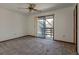 Bedroom with a sliding glass door leading to the balcony at 5339 Kings Ct, Fruitland Park, FL 34731