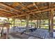 This covered dock has a wooden structure, concrete base, and direct access to the serene waterway at 5339 Kings Ct, Fruitland Park, FL 34731