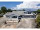 Aerial view showcases a home with a two-car garage, covered front porch, and a spacious driveway at 5339 Kings Ct, Fruitland Park, FL 34731