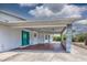 Charming front porch and green door that provides access to the home at 5339 Kings Ct, Fruitland Park, FL 34731