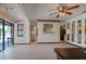 Open-concept kitchen with ceramic tile floor and pass through bar to dining room at 5339 Kings Ct, Fruitland Park, FL 34731