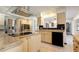 Bright kitchen featuring stainless steel appliances, granite counters, and center island at 5339 Kings Ct, Fruitland Park, FL 34731
