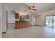 Ceramic tiled area with cabinets and counter space, and view of lanai at 5339 Kings Ct, Fruitland Park, FL 34731