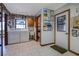 Bright laundry room with modern washer and dryer, adjacent half bath, and ample storage space at 5339 Kings Ct, Fruitland Park, FL 34731