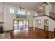 Bright living room with hardwood floors and large windows with a great waterfront view at 5339 Kings Ct, Fruitland Park, FL 34731