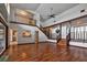 Inviting living room with wood floors, staircase and lots of space for entertaining at 5339 Kings Ct, Fruitland Park, FL 34731