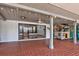 Expansive covered patio with tile flooring and bar area, leading to an inside entrance to the home at 5339 Kings Ct, Fruitland Park, FL 34731