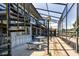 The outdoor patio offers ample seating and spiral stairs, great for access to the waterfront backyard at 5339 Kings Ct, Fruitland Park, FL 34731