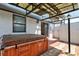 Back patio featuring a hot tub and an outdoor shower at 5339 Kings Ct, Fruitland Park, FL 34731