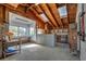 This spacious workshop features a high, wood-beamed ceiling, skylights, and custom woodworking features at 5339 Kings Ct, Fruitland Park, FL 34731