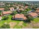 An aerial of a community of homes, featuring terracotta roofs and beautiful landscaping at 5492 Compass Pt, Oxford, FL 34484