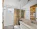 Cozy bathroom featuring a tub and shower combination with a decorative curtain at 5492 Compass Pt, Oxford, FL 34484