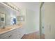 Bathroom with double sinks and tile floor at 5492 Compass Pt, Oxford, FL 34484
