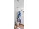Bathroom with a toilet and shower with white tiles and a floral shower curtain at 5492 Compass Pt, Oxford, FL 34484