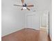 Spacious bedroom with hardwood floors, ceiling fan, and closet at 5492 Compass Pt, Oxford, FL 34484