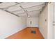 Spacious two car garage with a clean interior and lighting at 5492 Compass Pt, Oxford, FL 34484