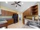 Functional kitchen with tile floors, plenty of cabinet space, modern stainless steel appliances, and a bright yellow wall at 5492 Compass Pt, Oxford, FL 34484